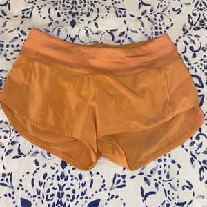 size 2 lululemon orange speed up short 2.5 inseem